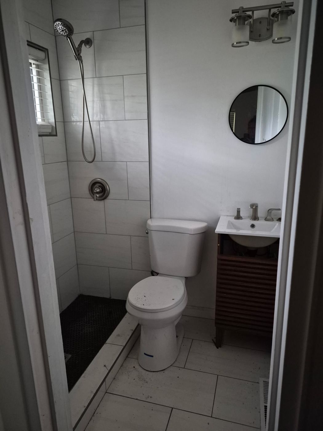 Second full bathroom with a tiled walk-in shower